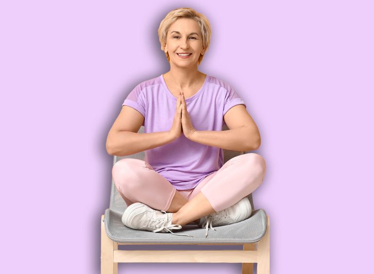 Portrait,Of,Meditating,Mature,Woman,Sitting,On,Chair,Against,Yellow