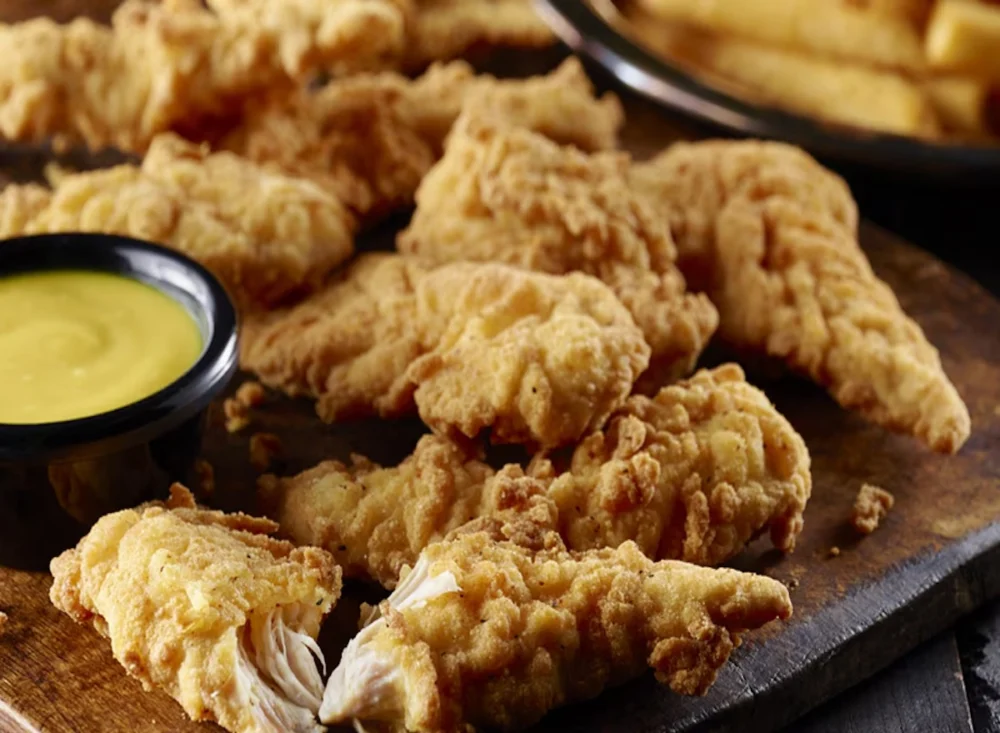 elevating-fast-casual-national-chains-committed-to-daily-hand-breading-for-superior-chicken-offerings