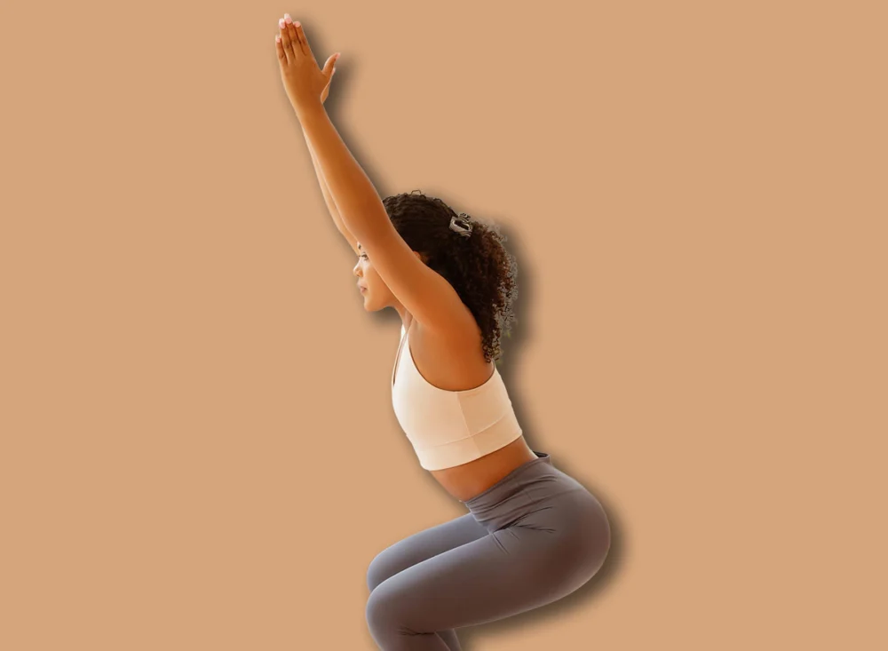 Young,Lady,Doing,Squats,With,Raised,Arms,Indoors,,Engages,In