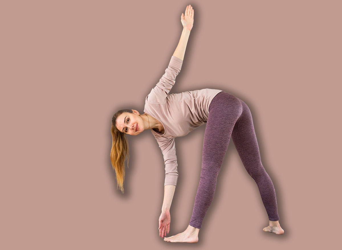 Rear,View,Of,Woman,And,Men,Doing,Windmill,Exercise,During