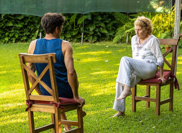 Senior,Woman,And,Her,Physiotherapist,Are,Sitting,On,Chairs,In