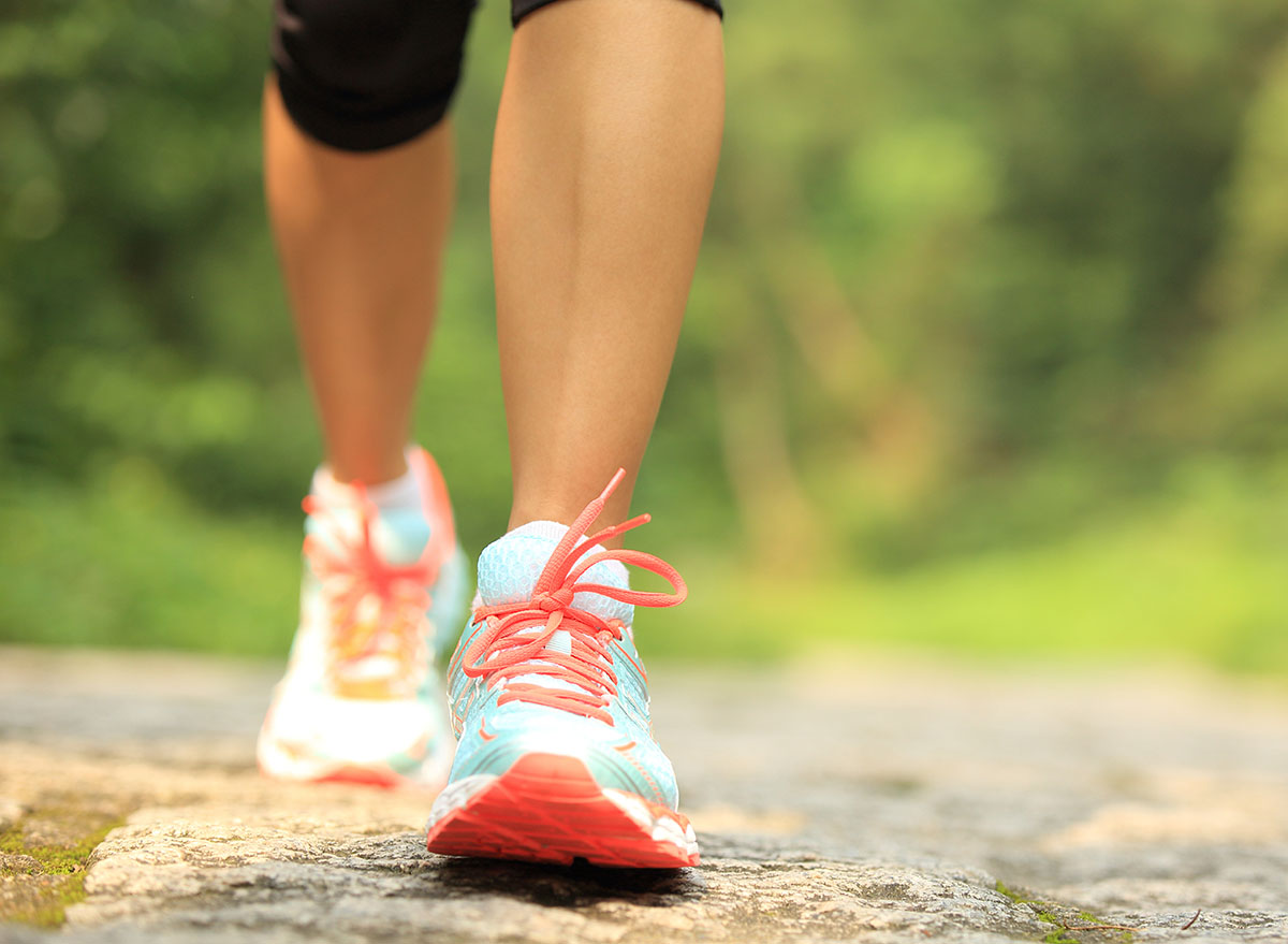 Young,Fitness,Woman,Legs,Walking,On,Forest,Trail