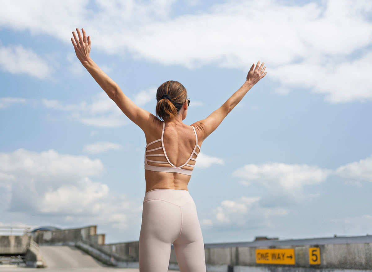 Fit,Sporty,Woman,With,Arms,Raised,Outdoors,,Freedom,Concept