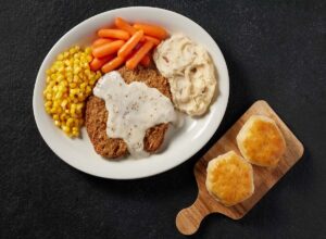 a-culinary-expedition-uncovering-exceptional-smothered-steak-dishes-at-prominent-american-restaurant-chains