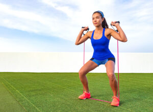 Exercise,Woman,With,Fitness,Elastic,Band,Workout,In,Outdoor,Gym