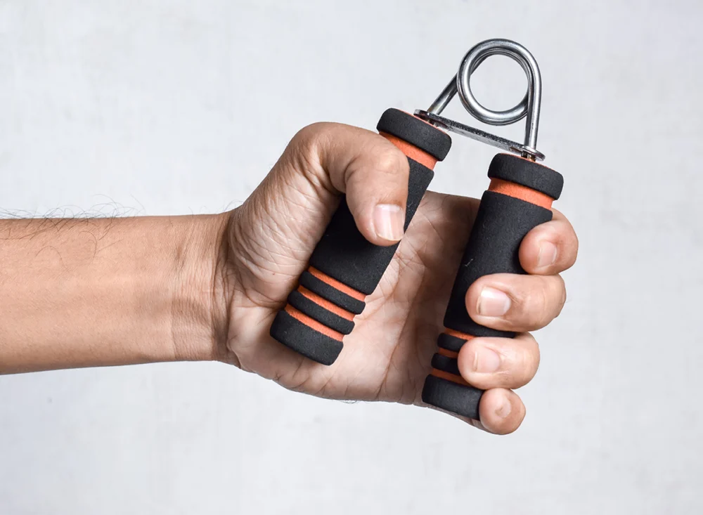 Hand,Of,Southeast,Asian,,Chinese,Man,Gripping,Hand,Exercise,Gripper.