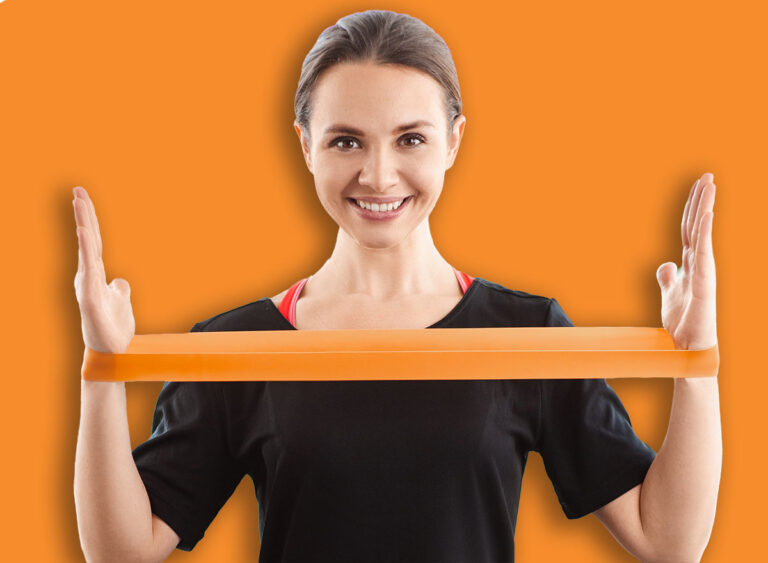 Smile,Woman,Exercising,With,Latex,Resistance,Band,In,Living,Room.