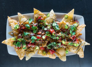 indulgent-shareable-appetizers-uncovering-the-most-substantial-nacho-platters-from-leading-restaurant-networks