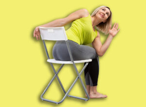 Yoga,With,A,Chair.,Adult,Caucasian,Woman,Sits,And,Practice