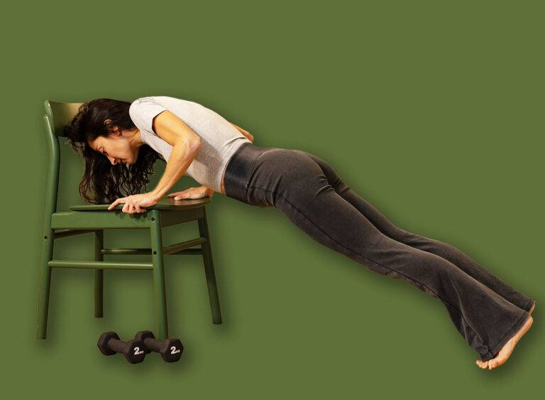 Fit,Woman,Performing,Incline,Push-up,Exercise,Using,Chair,At,Hom