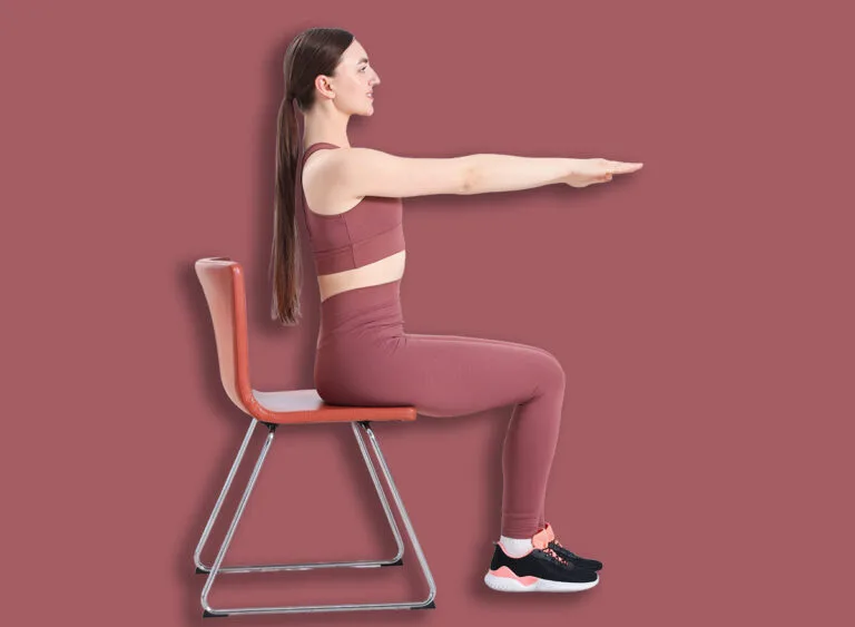 Beautiful,Woman,Stretching,On,Chair,At,Home
