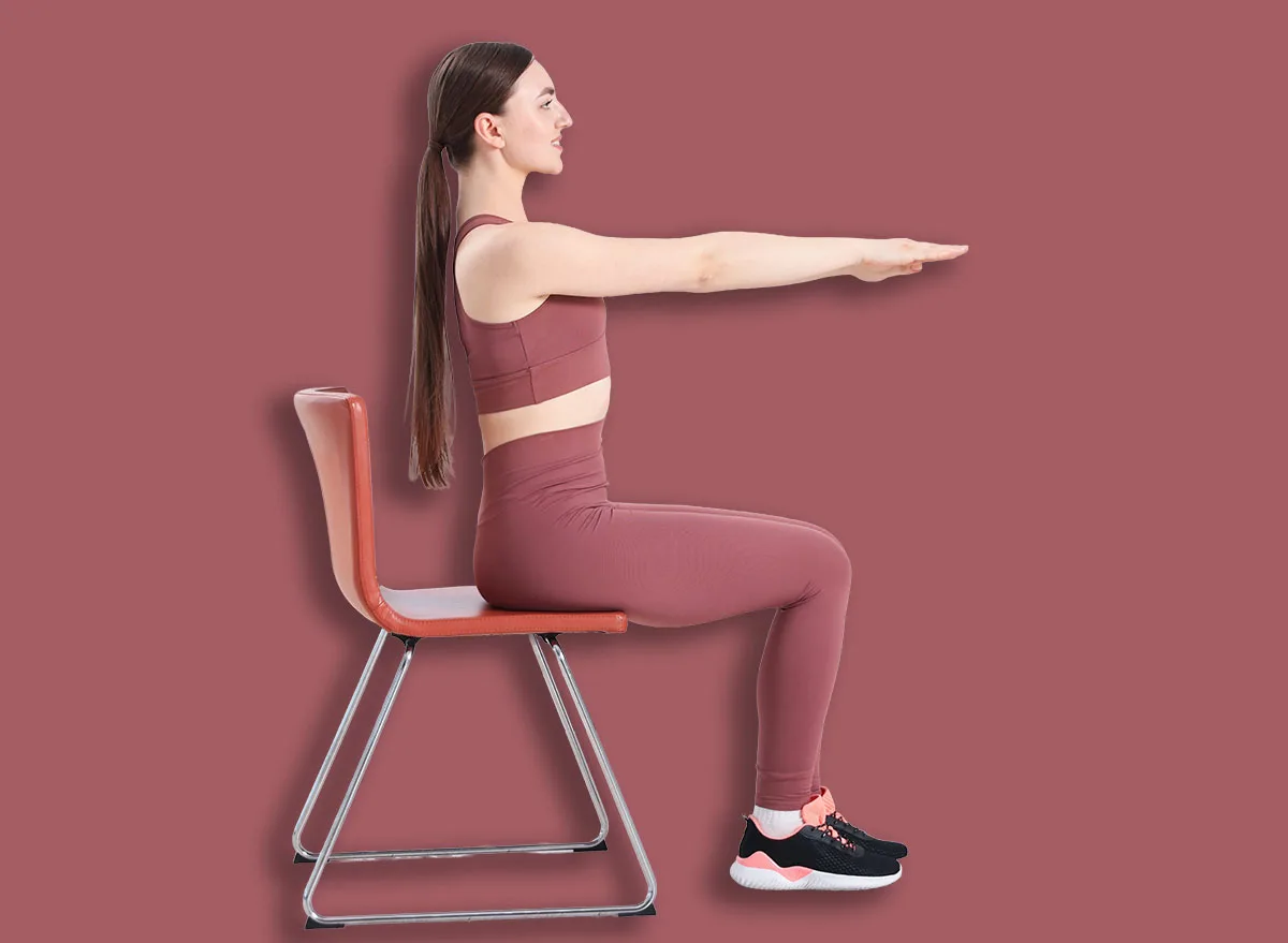 Beautiful,Woman,Stretching,On,Chair,At,Home