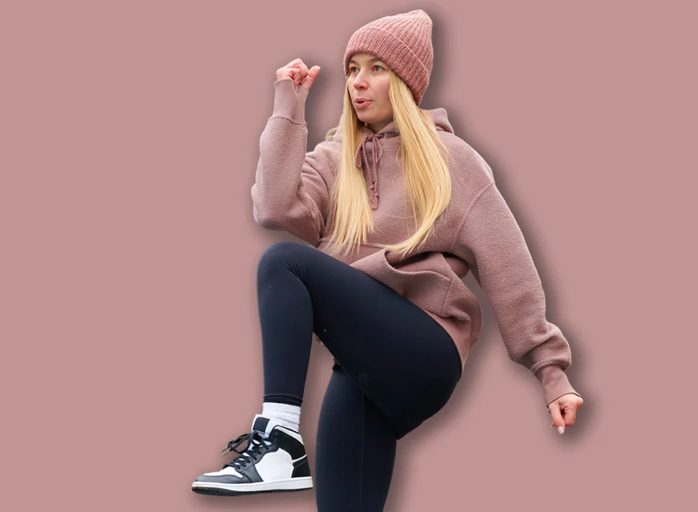 Young,Woman,Exercising,High,Knees,In,Outdoor,Park