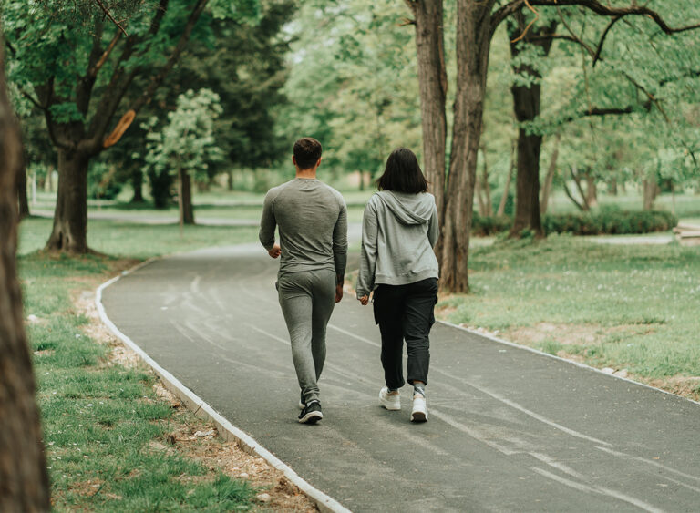 Sport,Couple,Walking,On,The,Path,In,The,Park
