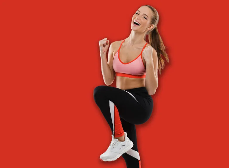 Full,Length,Portrait,Of,A,Cheerful,Young,Sportsgirl,Celebrating,Success