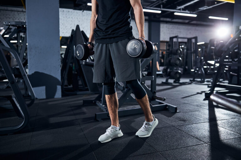 Cropped,Photo,Of,A,Sportsman,In,Shorts,And,White,Boots