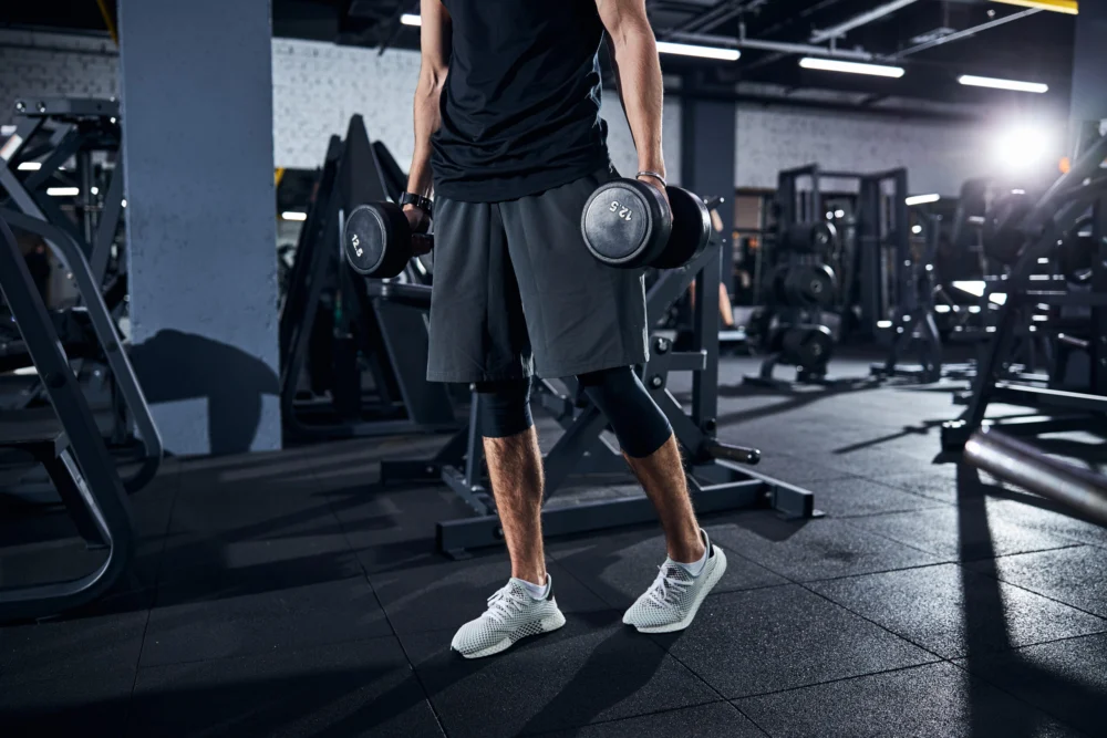 Cropped,Photo,Of,A,Sportsman,In,Shorts,And,White,Boots