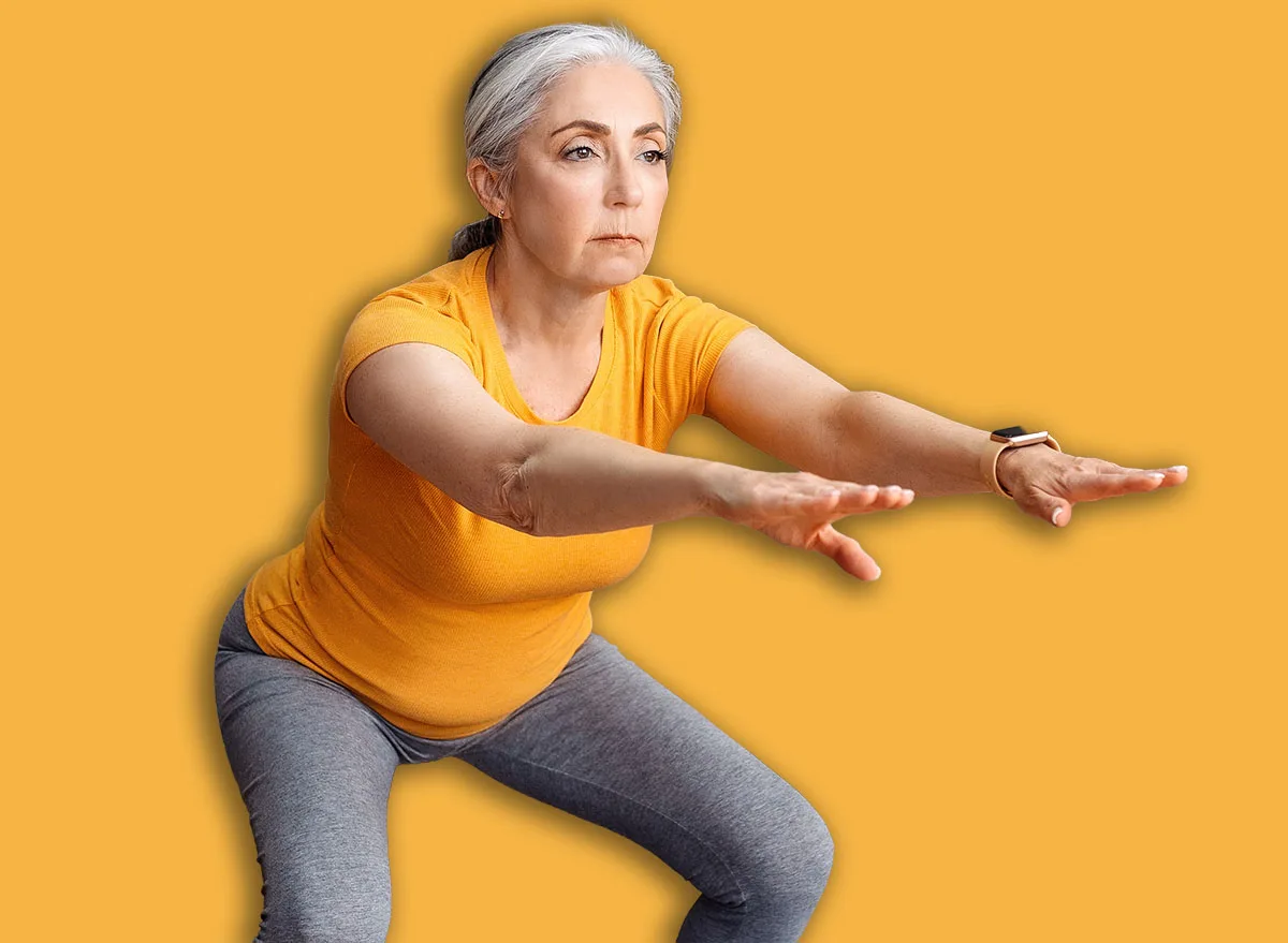 Home,Workout.,Senior,Lady,Doing,Squats,On,Yoga,Mat,,Working