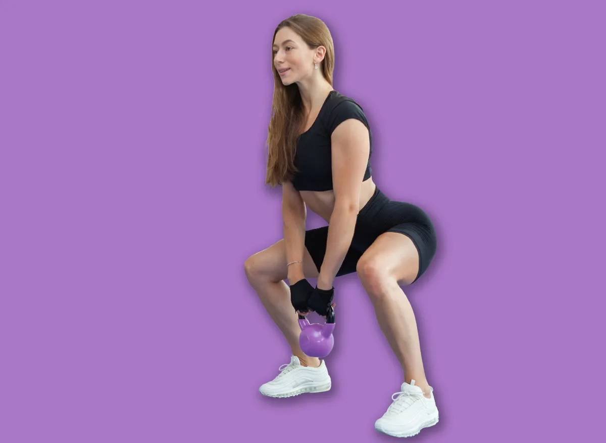 Attractive,Caucasian,Fitness,Woman,Exercising,With,Heavy,Kettlebell,In,Modern