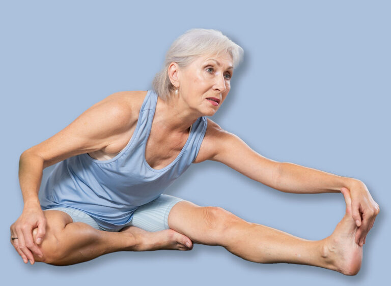 Sporty,Senior,Woman,Practicing,Yoga,With,Group,In,Modern,Studio,