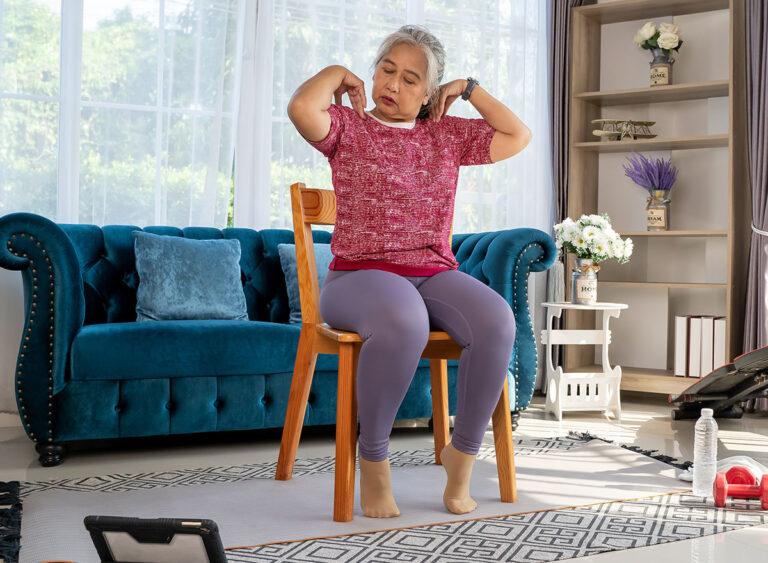Senior,Woman,Sitting,On,A,Wooden,Chair,And,Slowly,Rotate