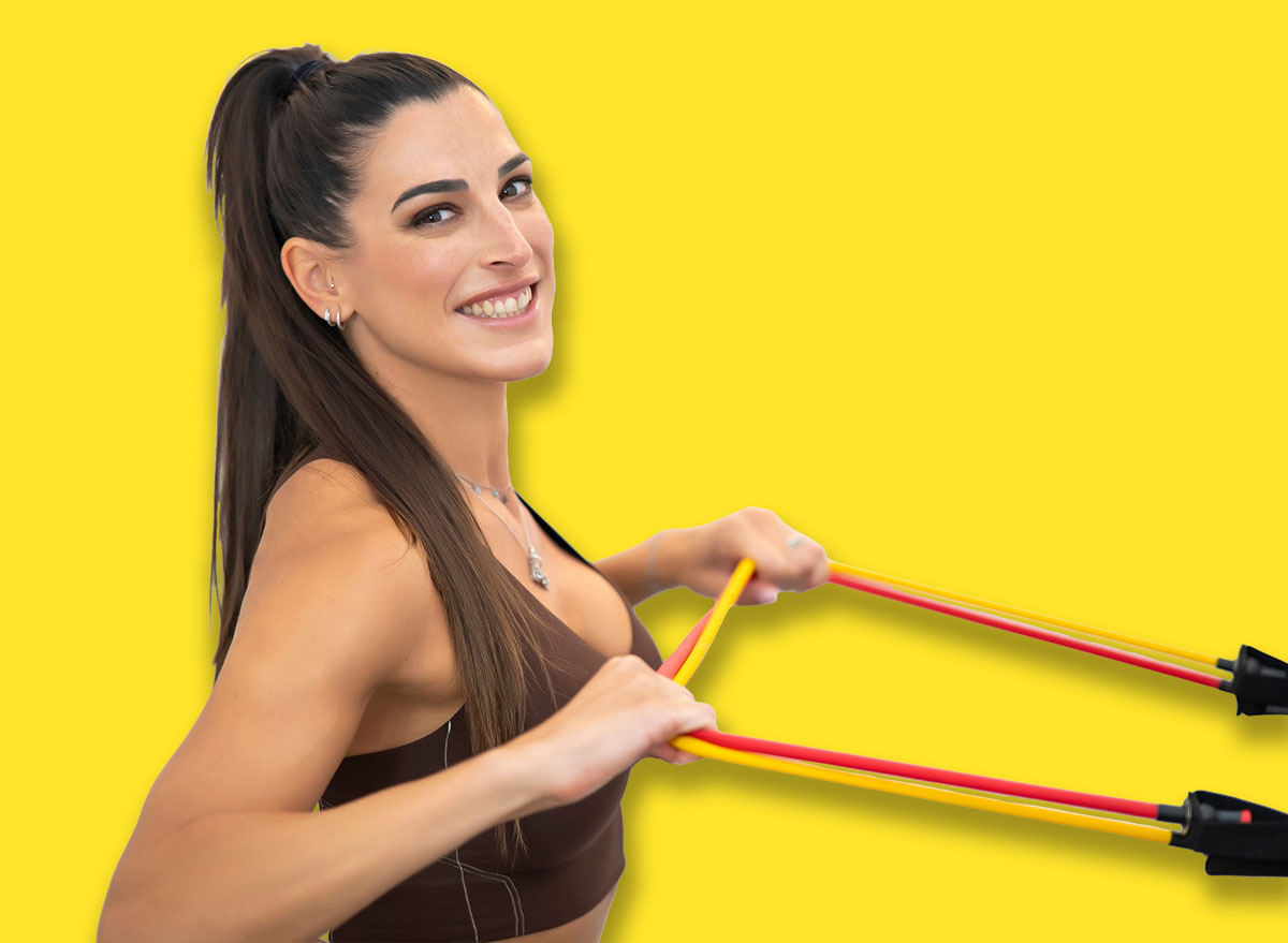 Smiling,Woman,Performing,Resistance,Band,Rows,During,Fitness,Session,,Showcasing