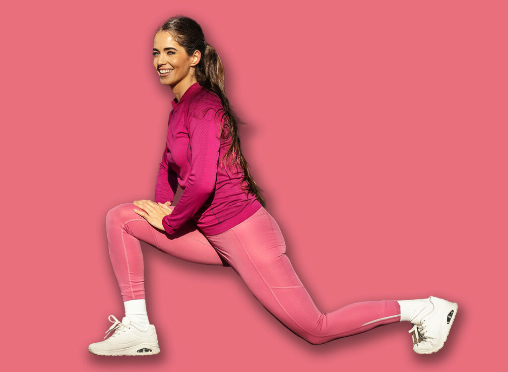A,Fit,Runner,Is,Stretching,Her,Leg,And,Doing,Warmup