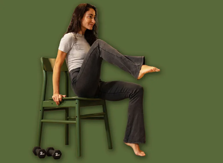 Athletic,Woman,Performing,Seated,Core,Exercise,On,Chair,At,Home