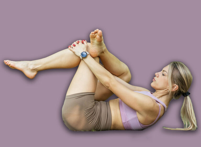 Young,Fit,Woman,Performing,A,Figure,Four,Stretch,On,Her