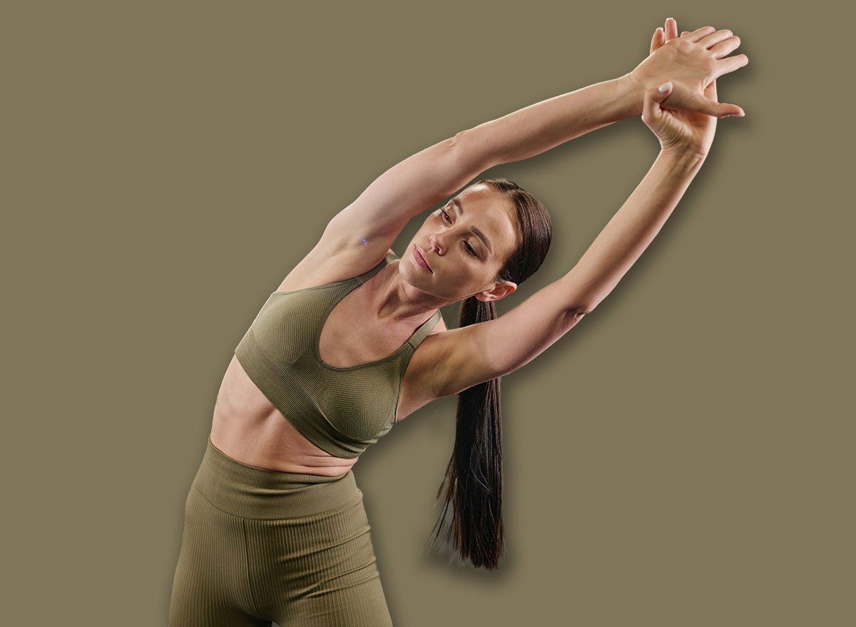 Toned,Brunette,Woman,Dressed,In,Sportswear,Doing,Side,Bendings,To