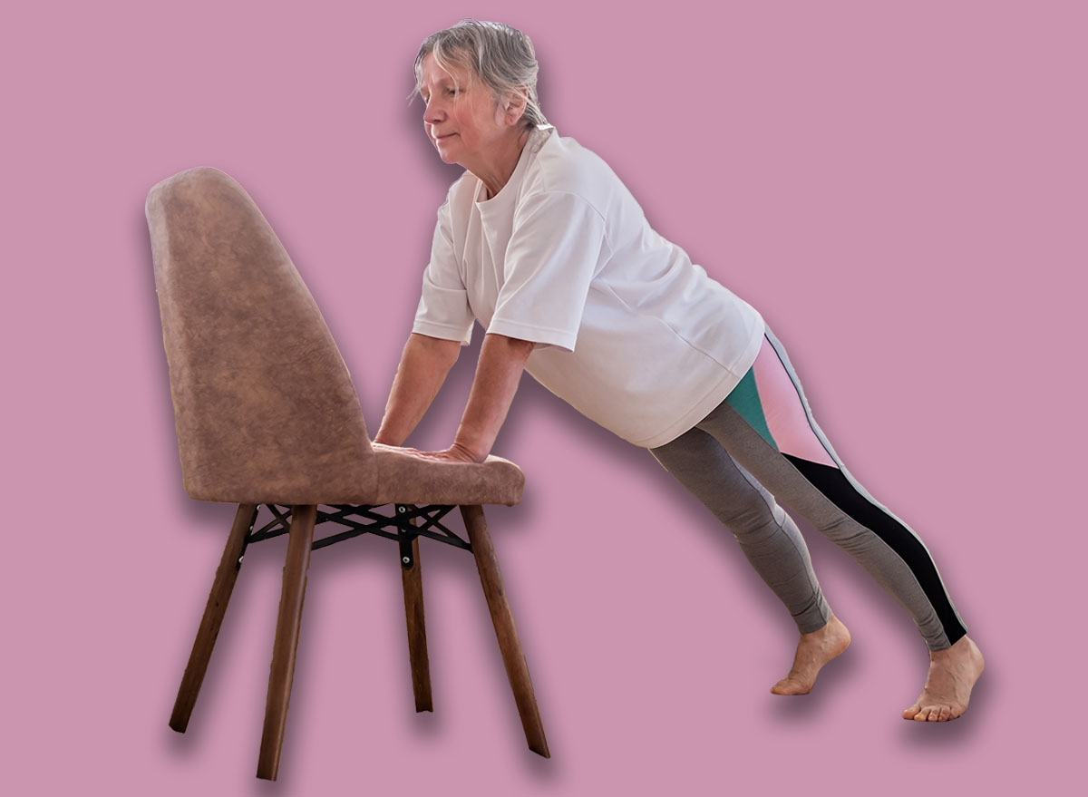 Senior,Caucasian,Woman,Doing,Yoga,At,Home,On,Chair