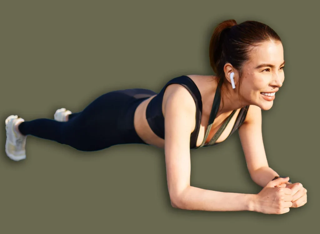 Fit,Woman,Performing,A,Forearm,Plank,On,A,Blue,Mat
