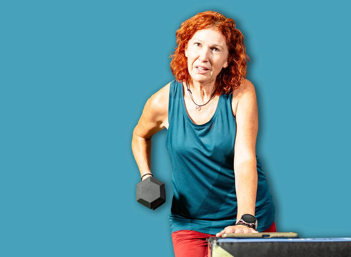 Senior,Woman,Performing,Single,Arm,Dumbbell,Row,Exercise,In,A
