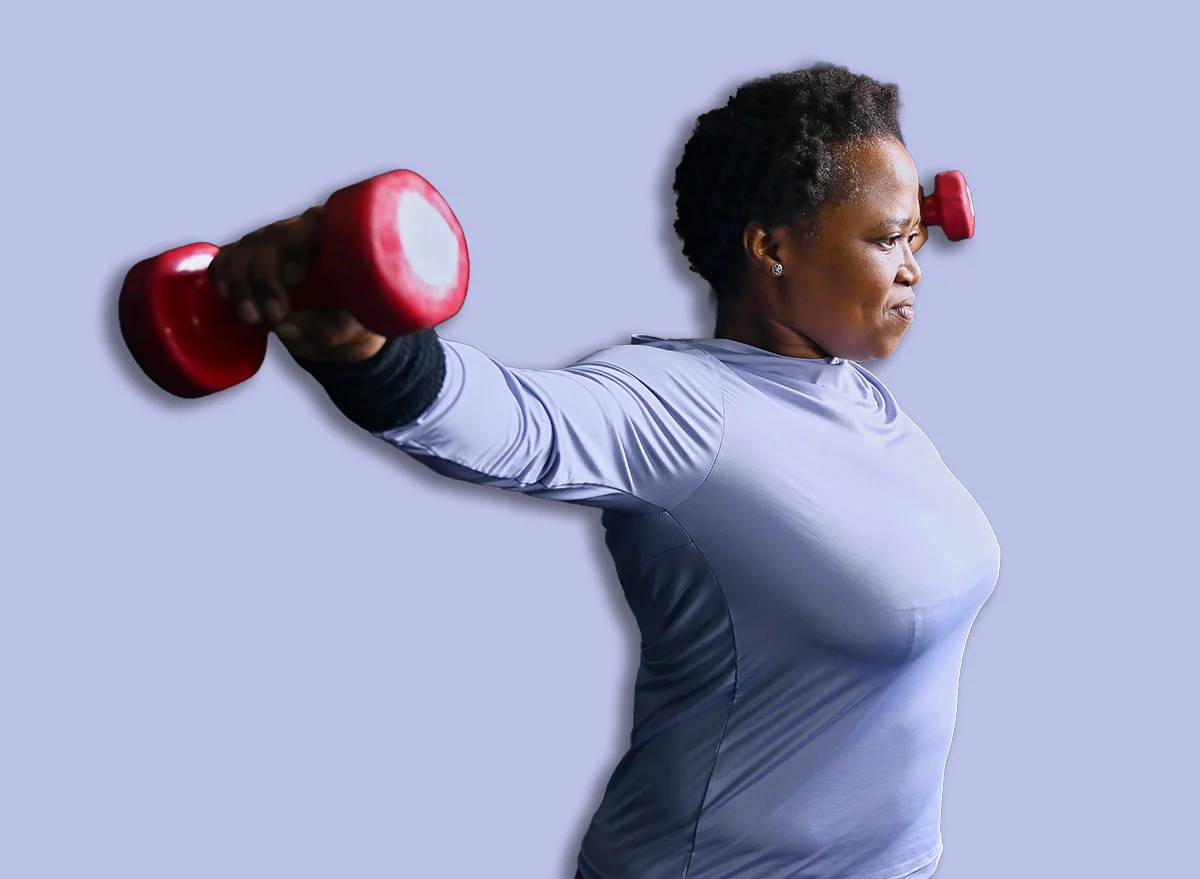 Person,Exercising,With,Dumbbells,In,Gym