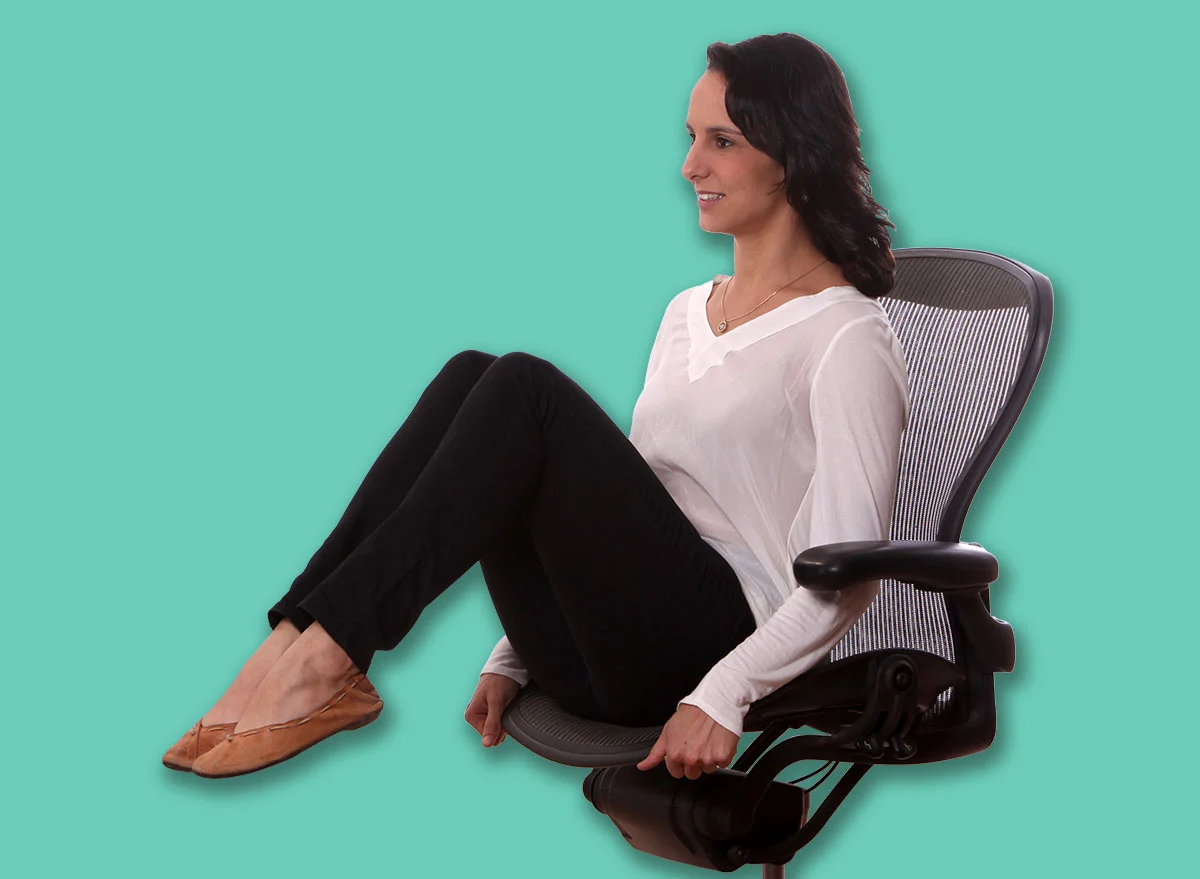 Female,Manager,Stretching,Up,On,Her,Chairs,Office,.