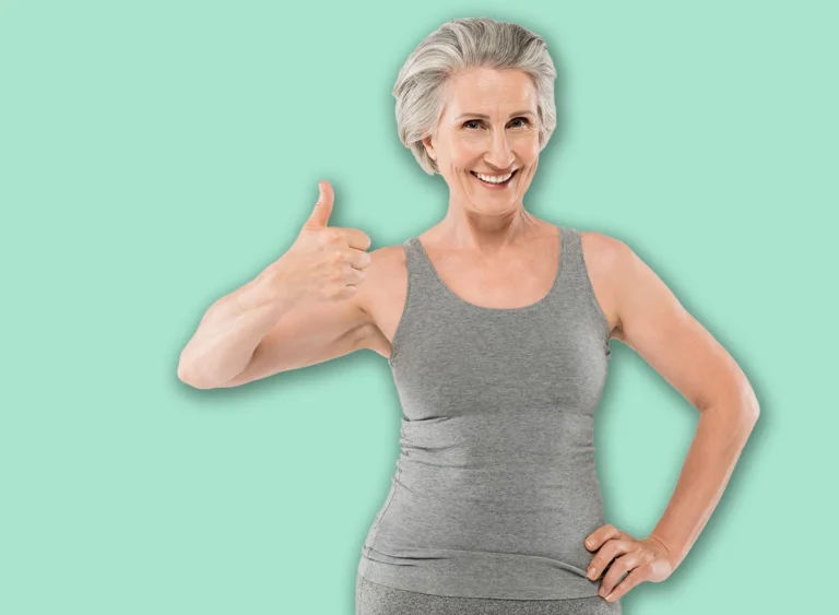 Cheerful,And,Retired,Woman,In,Sportswear,Posing,With,Hand,On