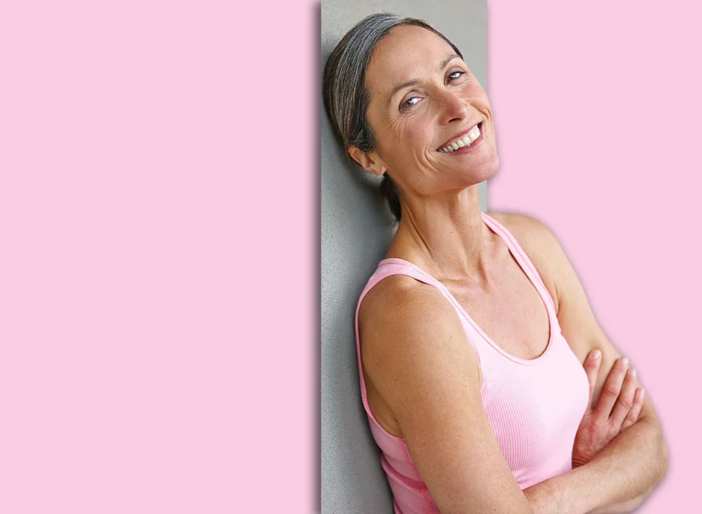 Gray,Wall,,Woman,And,Arms,Crossed,For,Fitness,With,Pride