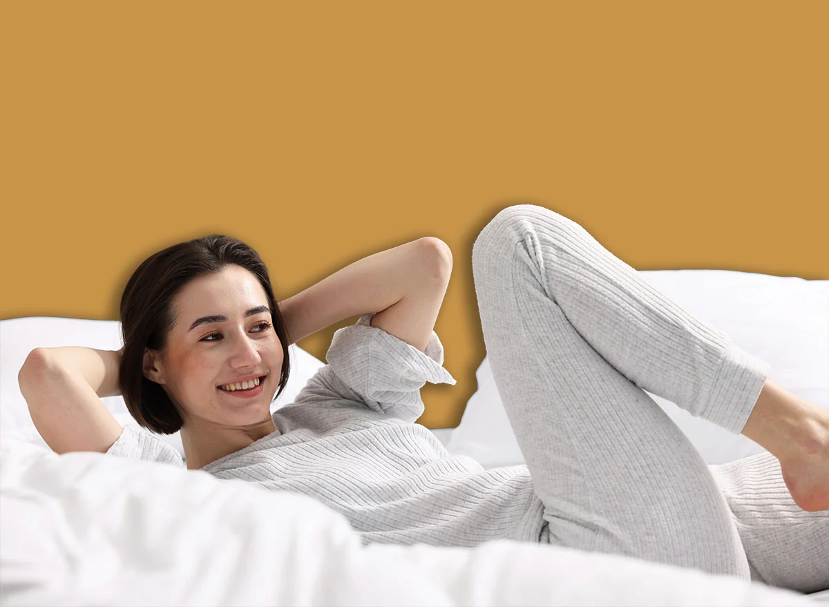 Young,Woman,Exercising,On,Bed,At,Home.,Morning,Routine