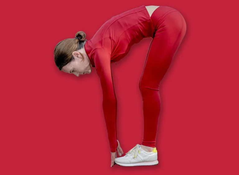 Sporty,Woman,Touching,Her,Toes,,Warm,Up,Exercises,Outdoors.