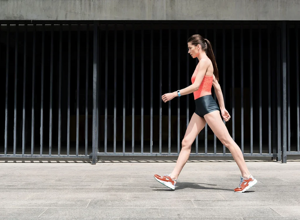 Slim,Sporty,Young,Girl,Walking,On,Street