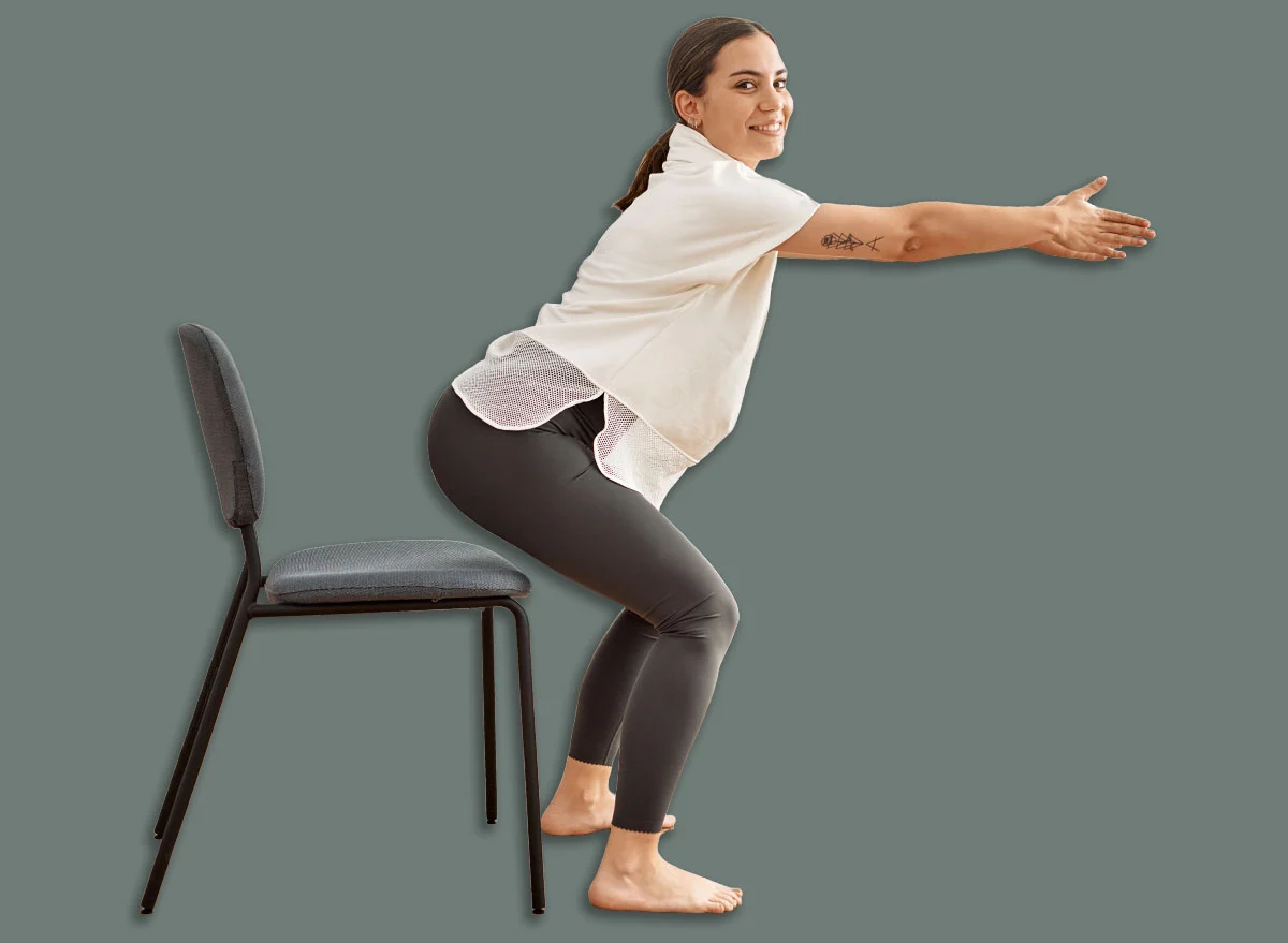 Young,Hispanic,Woman,Smiling,Confident,Stretching,At,Sport,Center.