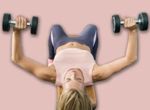 Attractive,Young,Woman,Exercising,With,Dumbbells,In,Modern,Gym